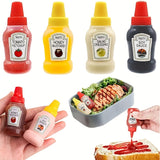 Juego de 4 Botellas Compactas para Condimentos - A prueba de Fugas, Recipientes de Plástico Reutilizables para Ketchup, Mostaza, Mayonesa y Aderezo para Ensaladas, 21g - Ideales para Loncheras, Picnics y Comidas al Día, Botellas de Ketchup y Mostaza