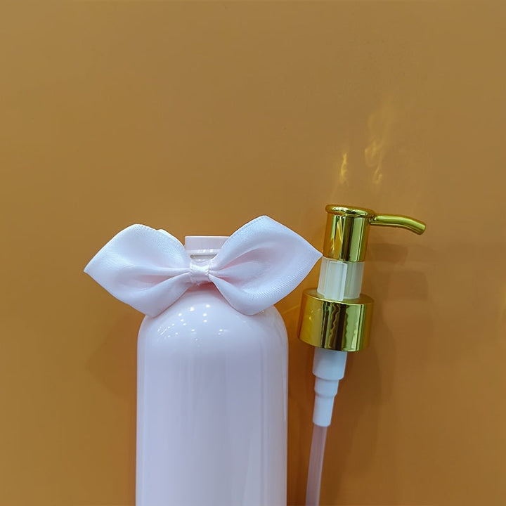 1/2 piezas 250ml Botella vacía de tipo prensa rosa con lazo, Detergente para ropa Gel de ducha Champú Loción Acondicionador Botella recargable dividida, Decoración del hogar