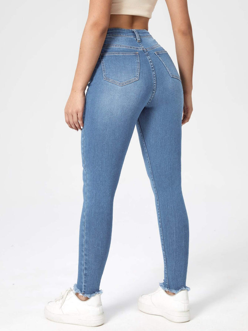 Essnce Jeans ajustados de talle alto bajo crudo