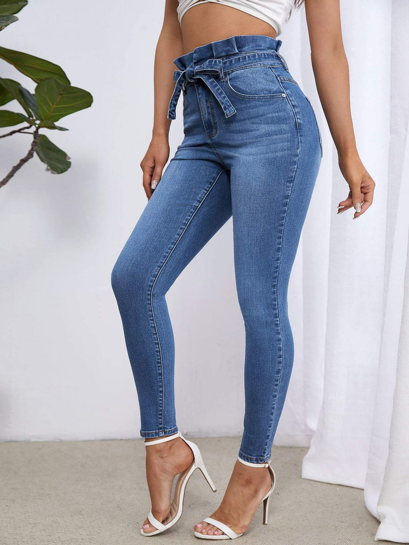 Essnce Jeans ajustados de talle alto con cinturon