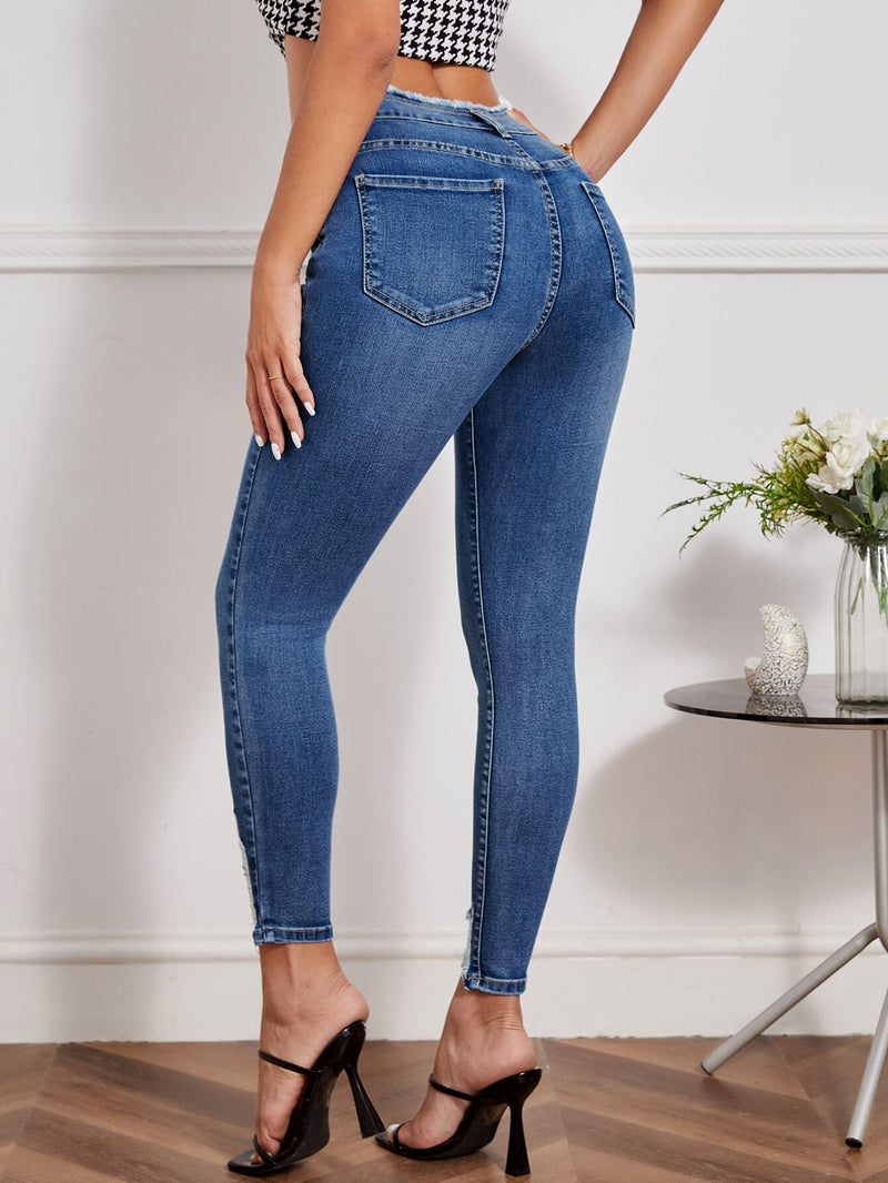 Essnce Jeans ajustados desgarro ribete sin dobladillo