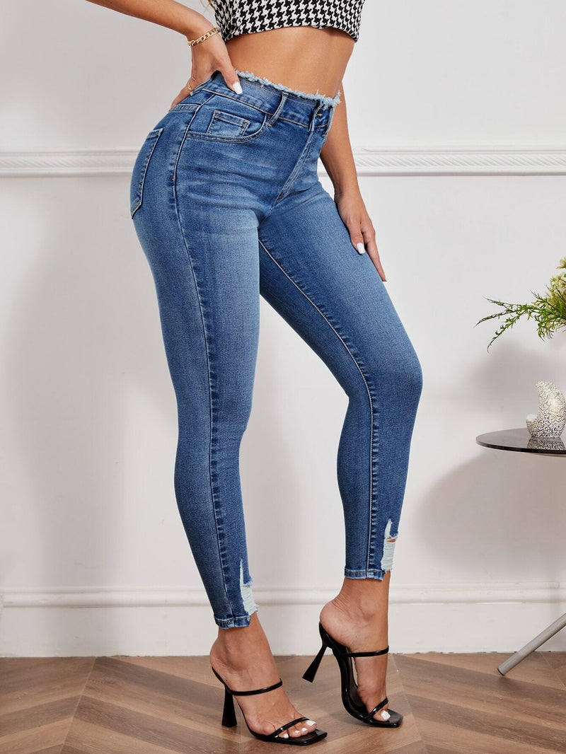 Essnce Jeans ajustados desgarro ribete sin dobladillo