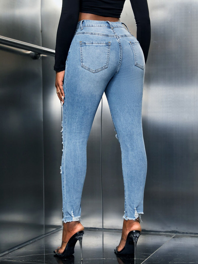 SXY Jeans ajustados con abertura desgarro crudo