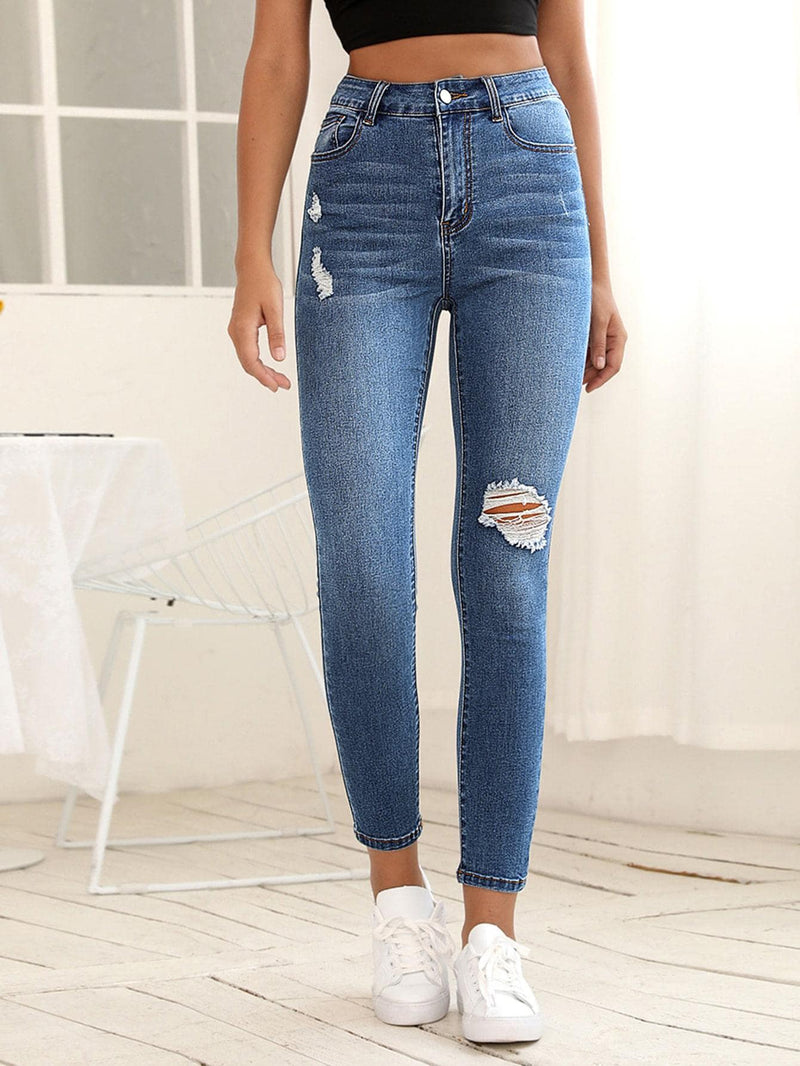 Essnce Jeans ajustados con diseno roto