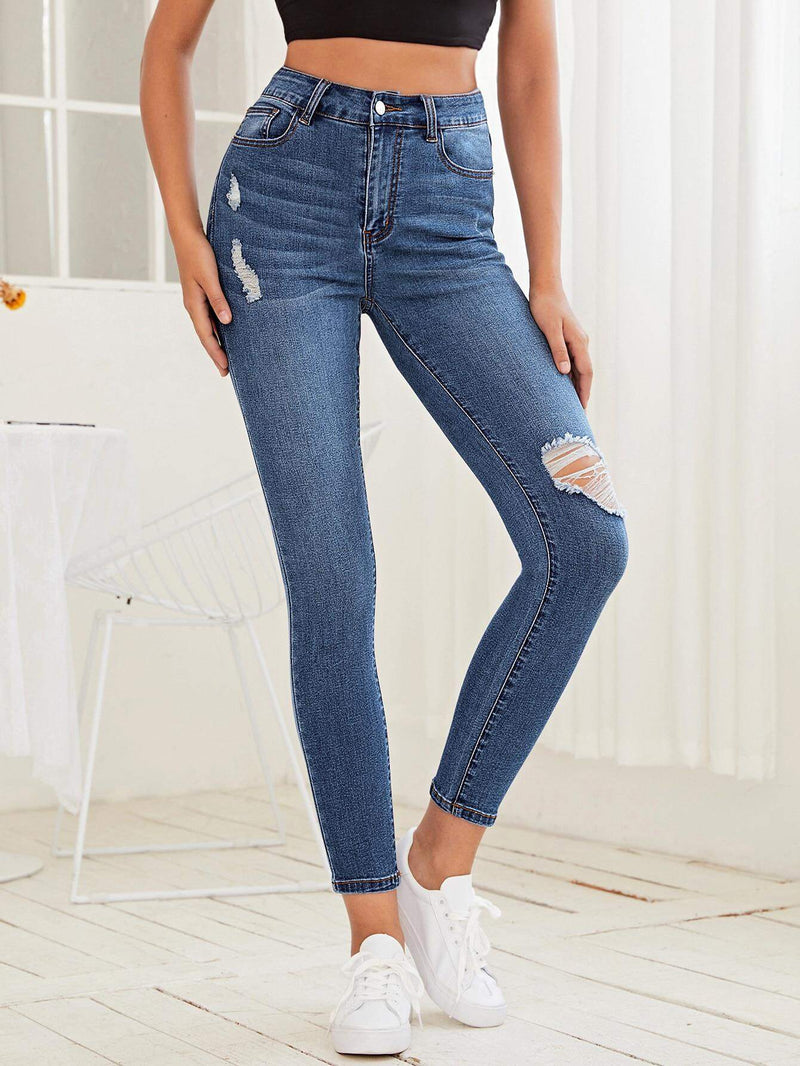 Essnce Jeans ajustados con diseno roto