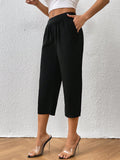 Pantalones capris unicolor con bolsillo oblicuo