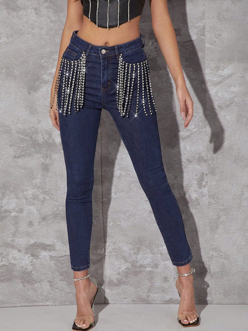 Jeans ajustados con diamante de imitacion con fleco