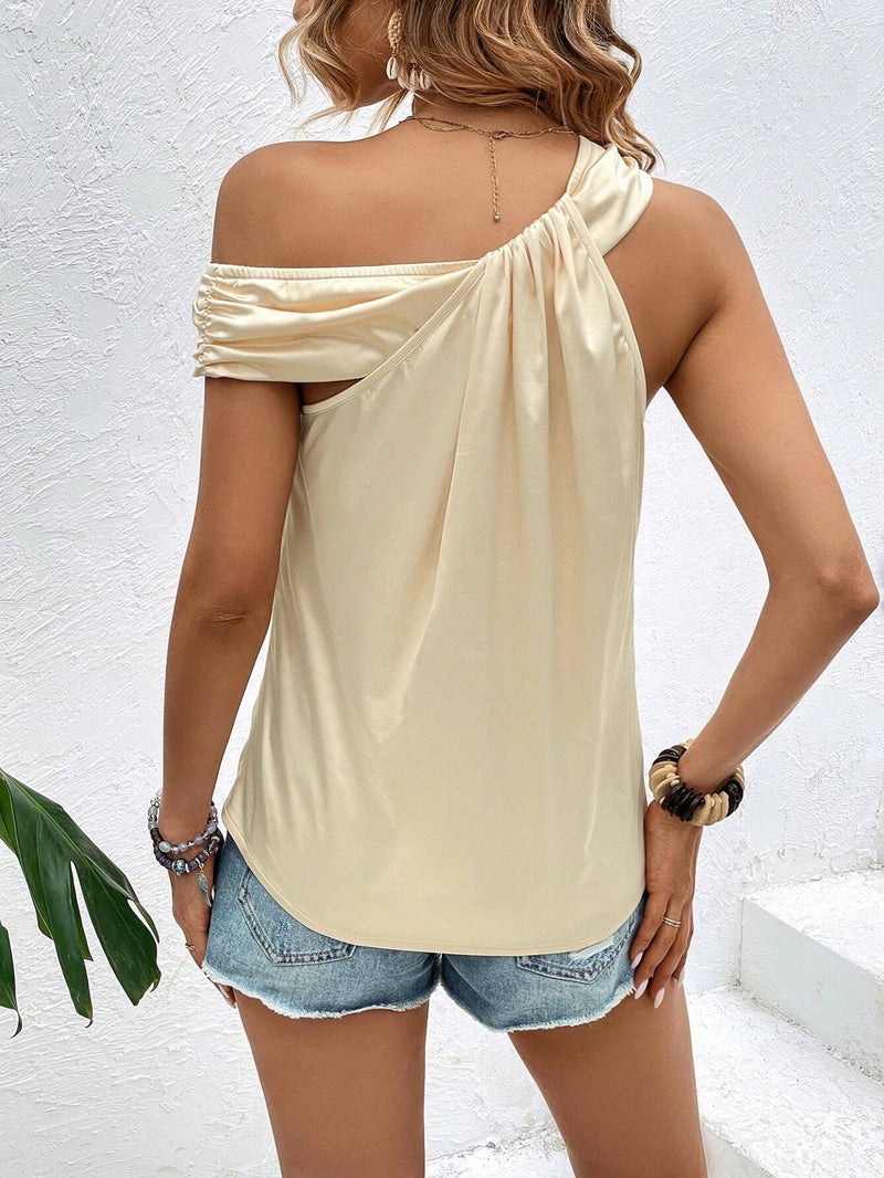 Blusa girante delantero de cuello asimetrico unicolor