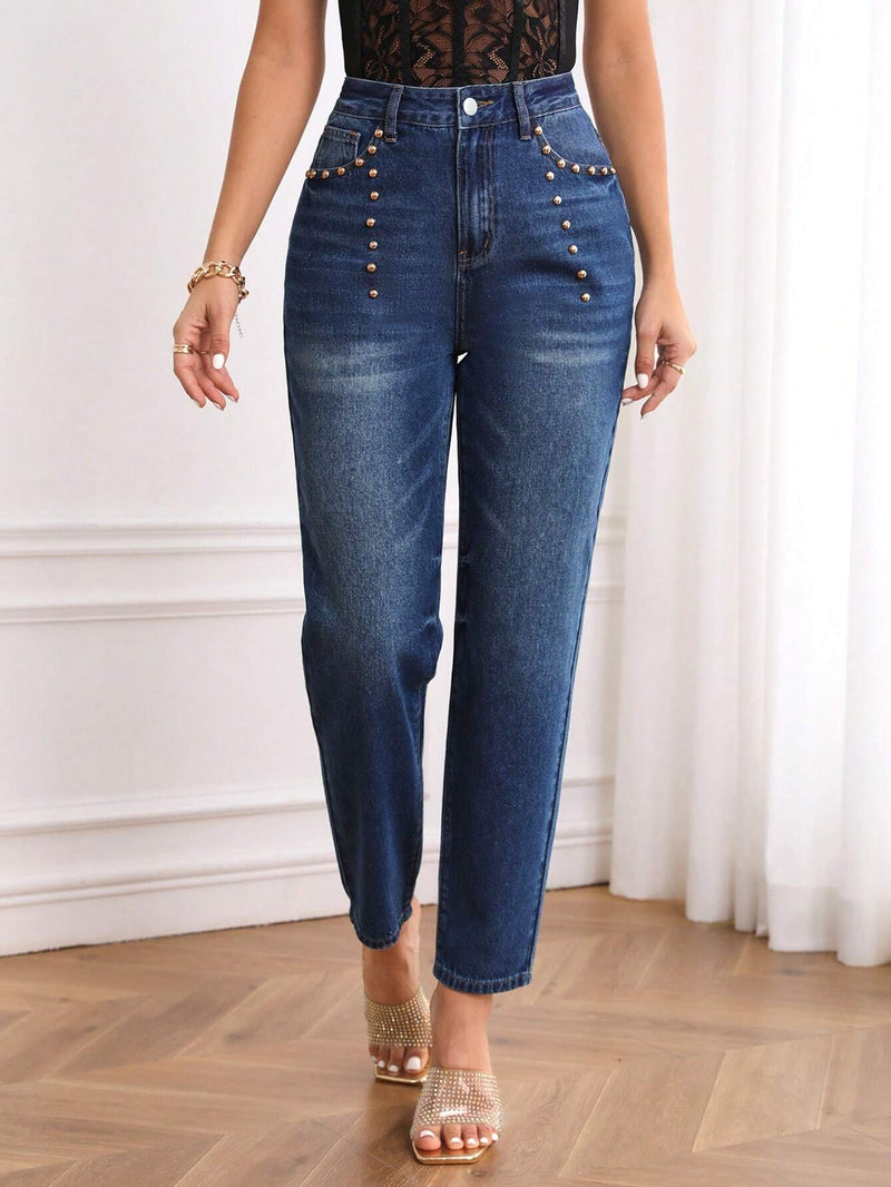 Jeans ajustados de talle alto con diseno de boton