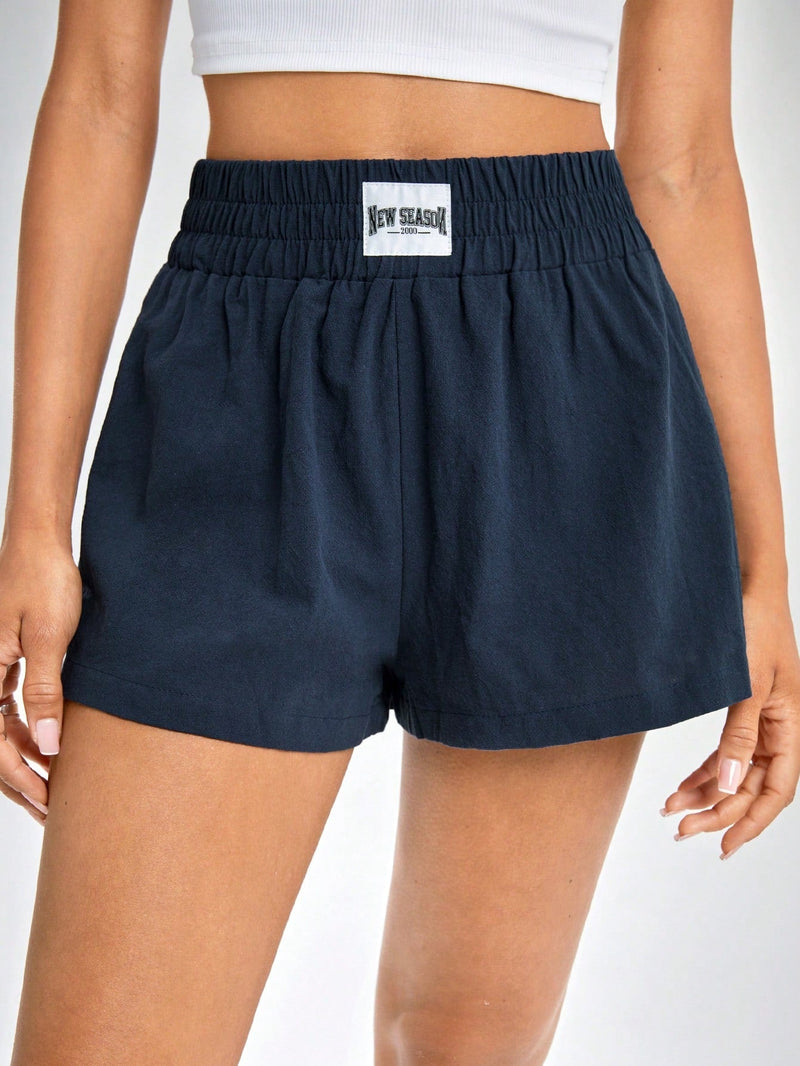 Shorts de pierna ancha con diseno de parche de letra