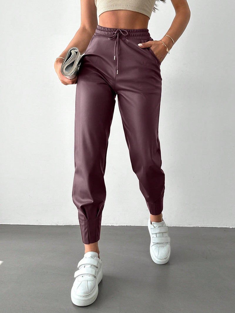 Pantalones con punos elasticos y cintura con cordon de color liso para mujer