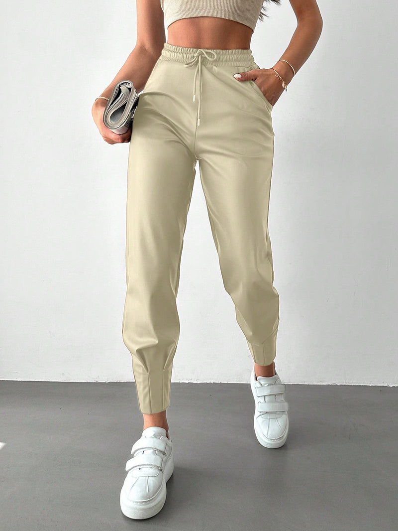 Pantalones con punos elasticos y cintura con cordon de color liso para mujer