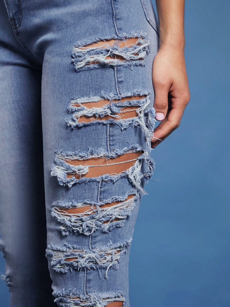 Haute Jeans Rasgados Ajustados A La Cintura Alta Con Detalle En Los Lados