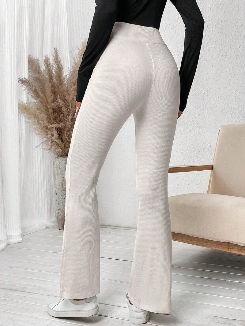 LUNE Pantalones Acampanados Con Cintura Asimetrica