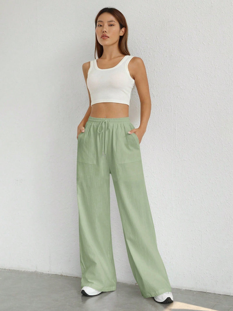 Pantalones sueltos de pierna ancha de color solido para mujer con dobladillo fluido, estilo casual