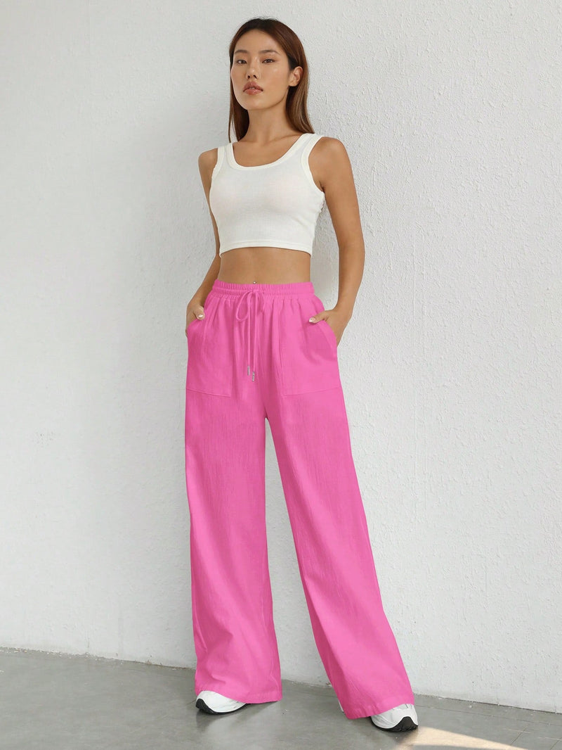 Pantalones sueltos de pierna ancha de color solido para mujer con dobladillo fluido, estilo casual