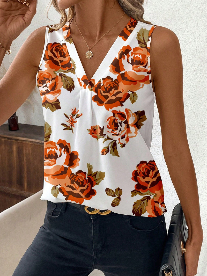 Blusa de mujer sin mangas y ajustada con diseno floral naranja y cuello en V, base blanca