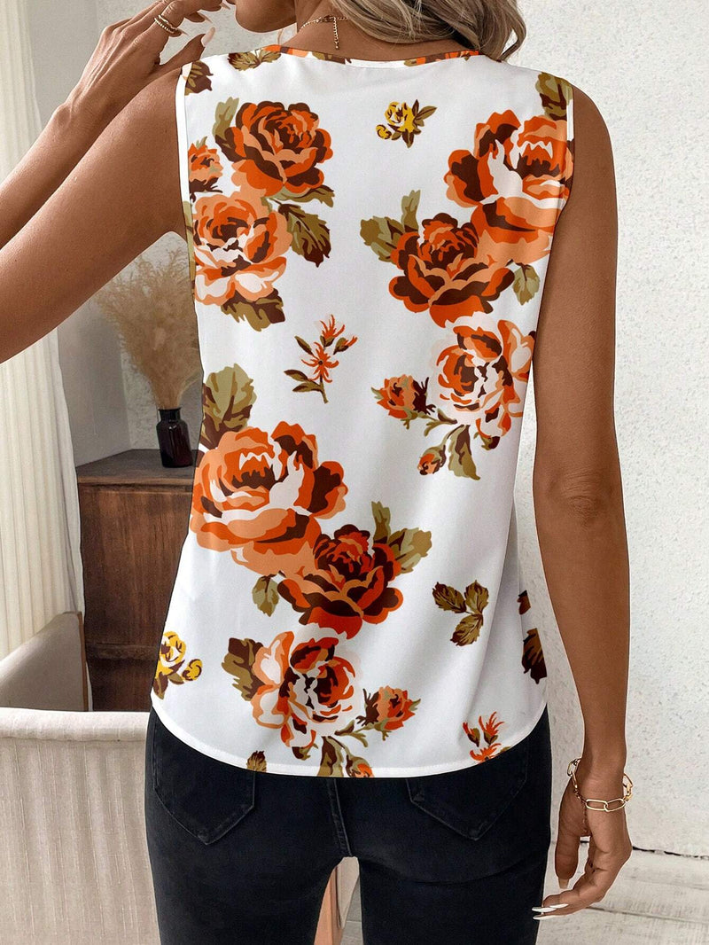 Blusa de mujer sin mangas y ajustada con diseno floral naranja y cuello en V, base blanca