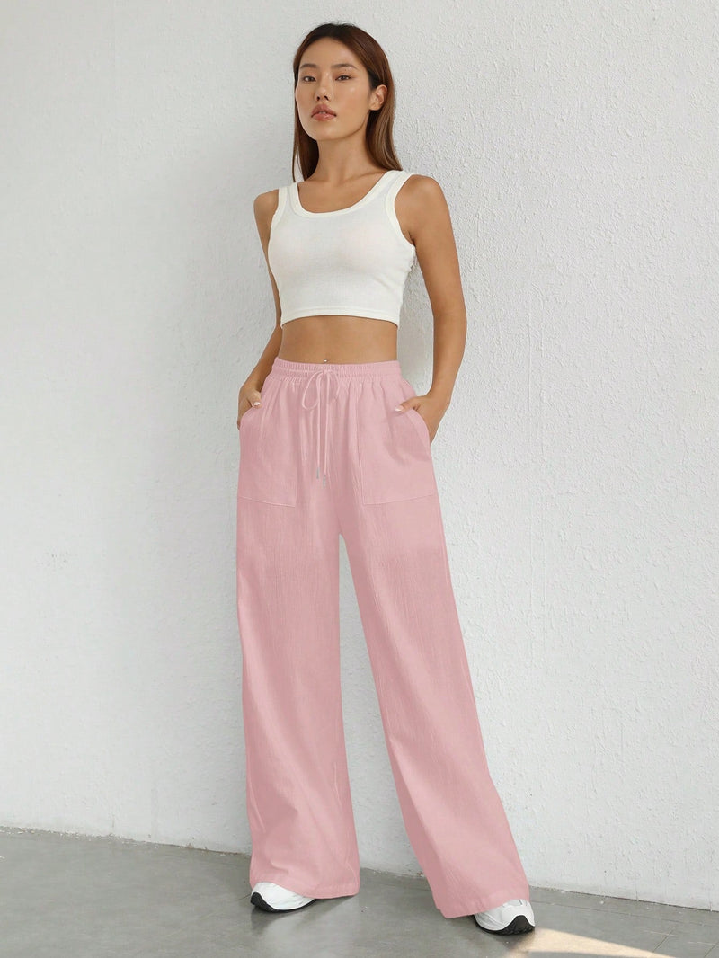 Pantalones sueltos de pierna ancha de color solido para mujer con dobladillo fluido, estilo casual