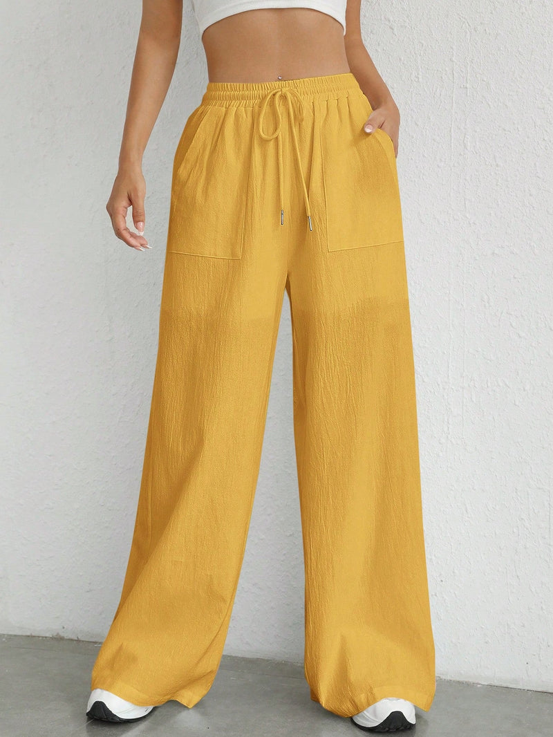 Pantalones sueltos de pierna ancha de color solido para mujer con dobladillo fluido, estilo casual