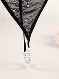 Tanga de mujer con espalda en t, calzoncillos de tiro bajo con cadena de perlas falsas, ropa interior sexy, negro