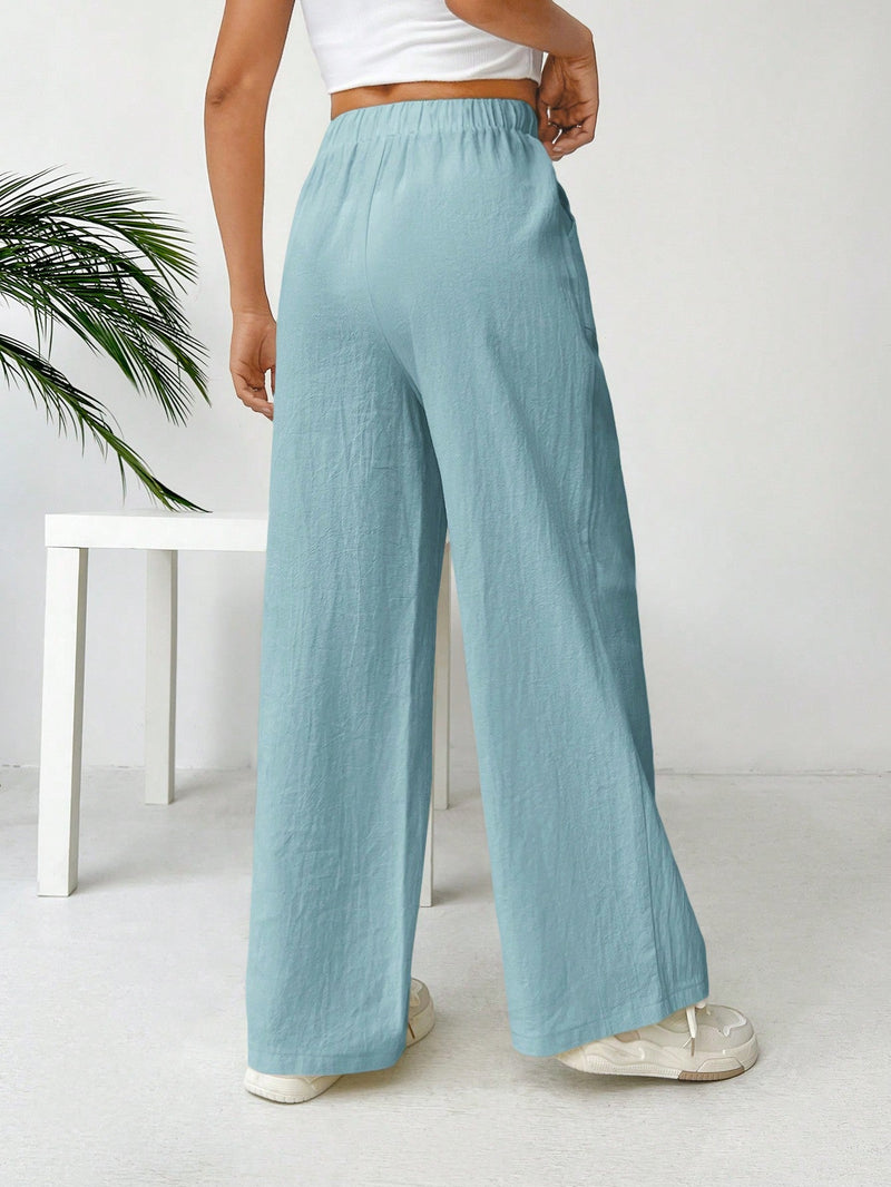 Pantalones sueltos de pierna ancha de color solido para mujer con dobladillo fluido, estilo casual