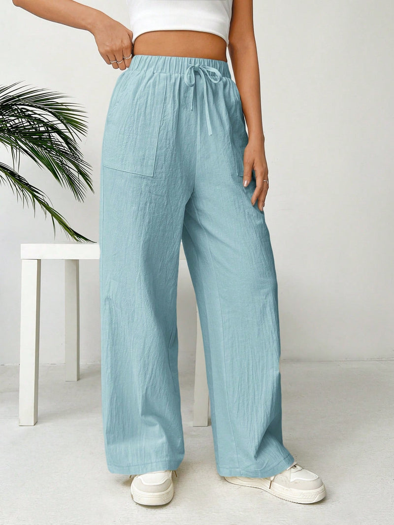 Pantalones sueltos de pierna ancha de color solido para mujer con dobladillo fluido, estilo casual