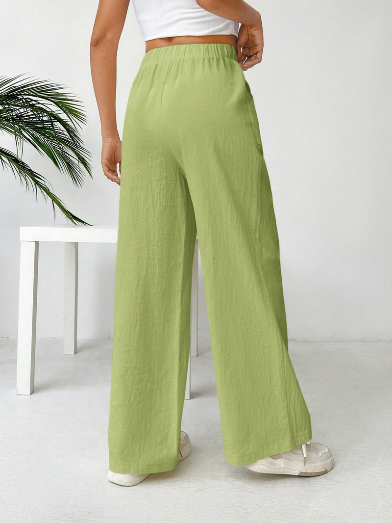 Pantalones sueltos de pierna ancha de color solido para mujer con dobladillo fluido, estilo casual