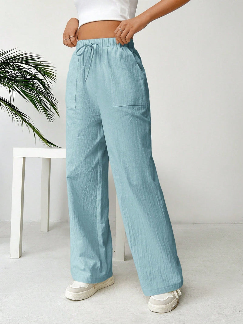 Pantalones sueltos de pierna ancha de color solido para mujer con dobladillo fluido, estilo casual