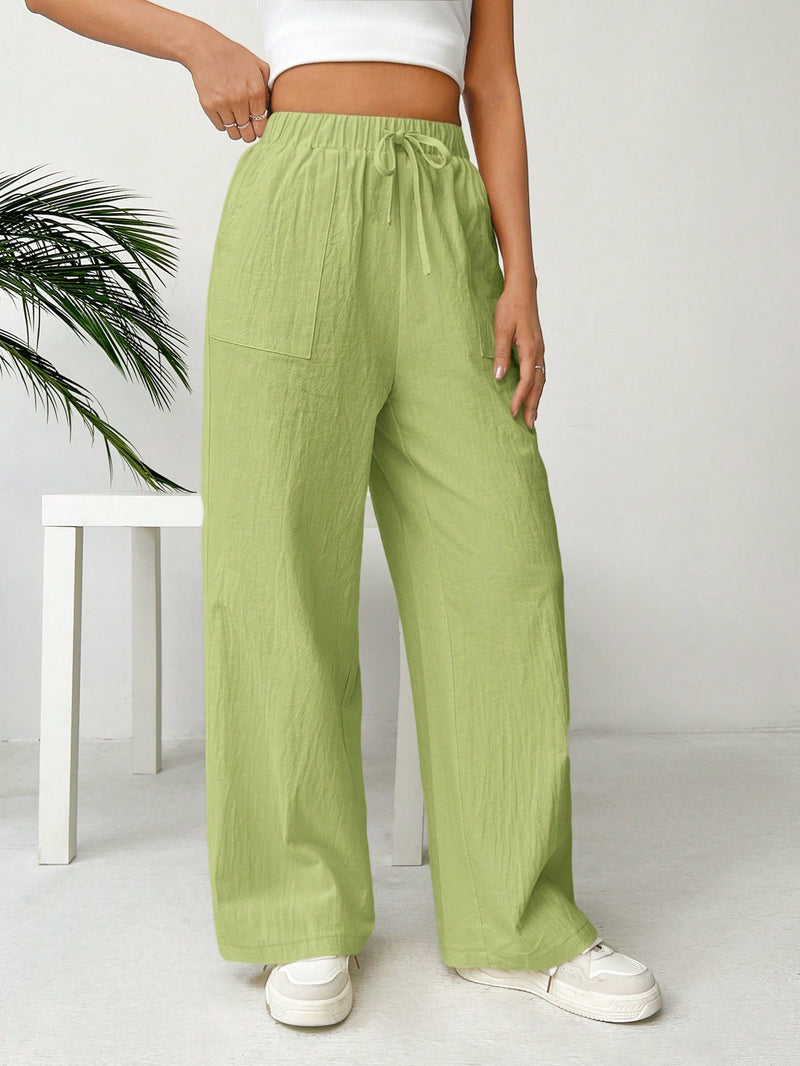 Pantalones sueltos de pierna ancha de color solido para mujer con dobladillo fluido, estilo casual