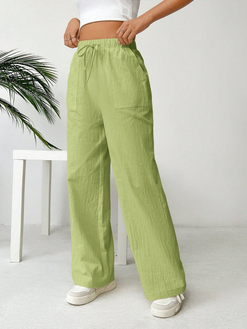 Pantalones sueltos de pierna ancha de color solido para mujer con dobladillo fluido, estilo casual