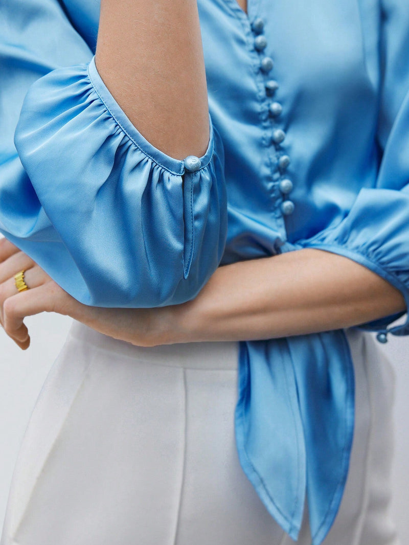 Camisa elegante para el trabajo de mujer en azul con lazo