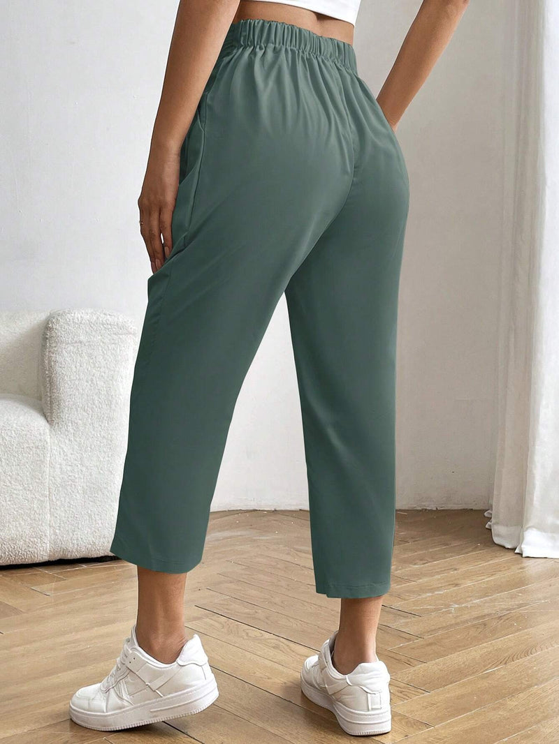 Essnce Pantalones casuales plisados de unicolor con corte conico