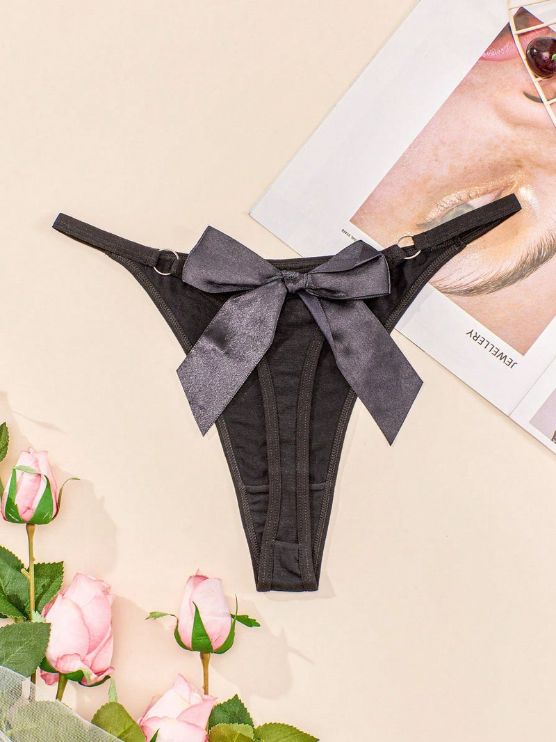 Tanga de encaje negro con decoracion de lazo, sensual y de talle bajo