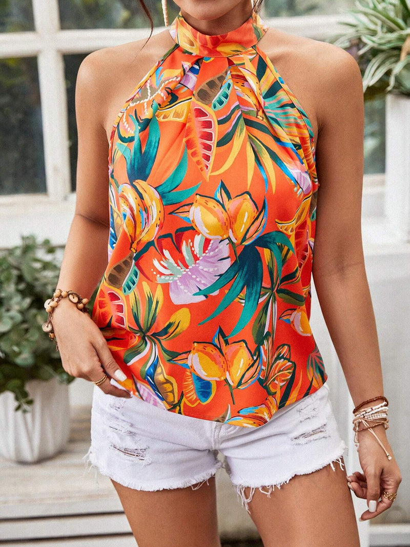 Parte superior de mujer con diseno floral, cuello halter y espalda descubierta para verano en la playa