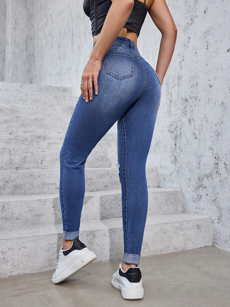 Jeans casuales ajustados para mujer con mosca de botones y parte frontal desgastada