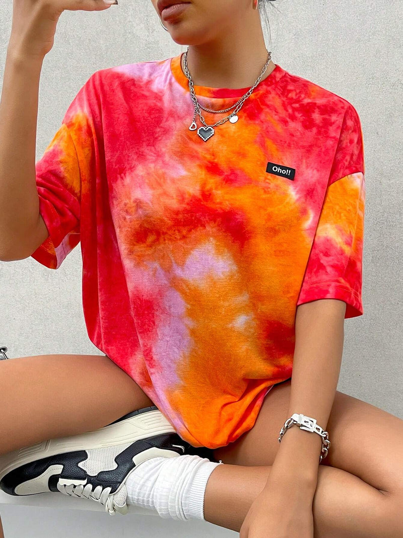 Camiseta casual de verano holgada para mujeres con cuello redondo, mangas caidas, patron de alfabeto y estampado de tie-dye