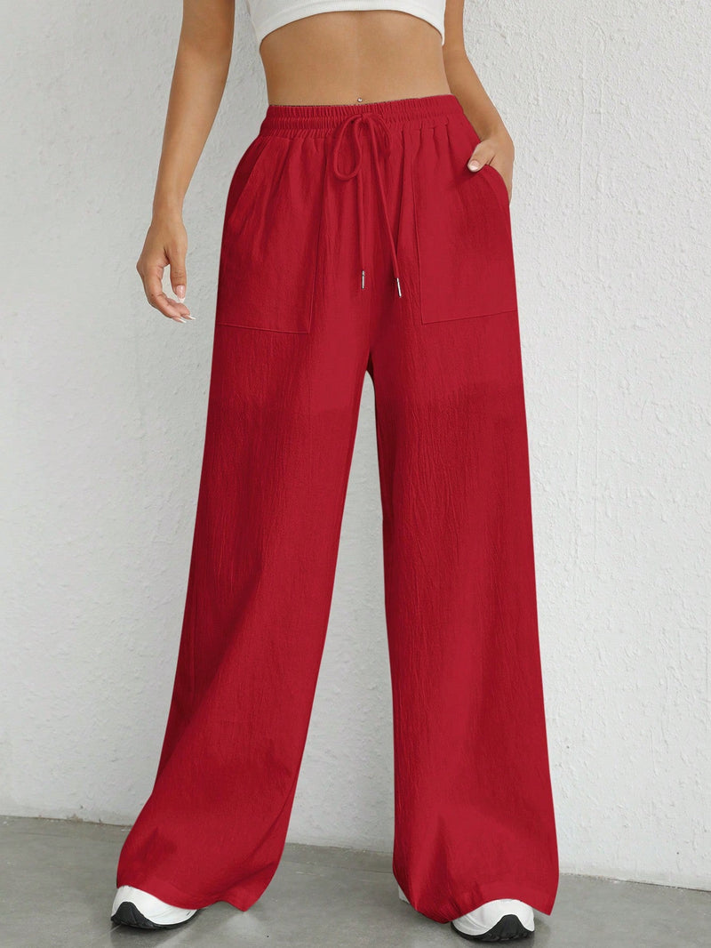 Pantalones sueltos de pierna ancha de color solido para mujer con dobladillo fluido, estilo casual