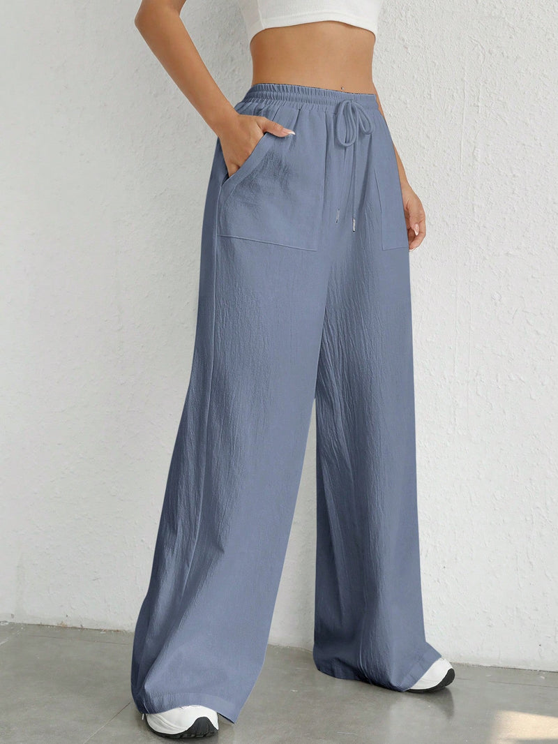 Pantalones sueltos de pierna ancha de color solido para mujer con dobladillo fluido, estilo casual