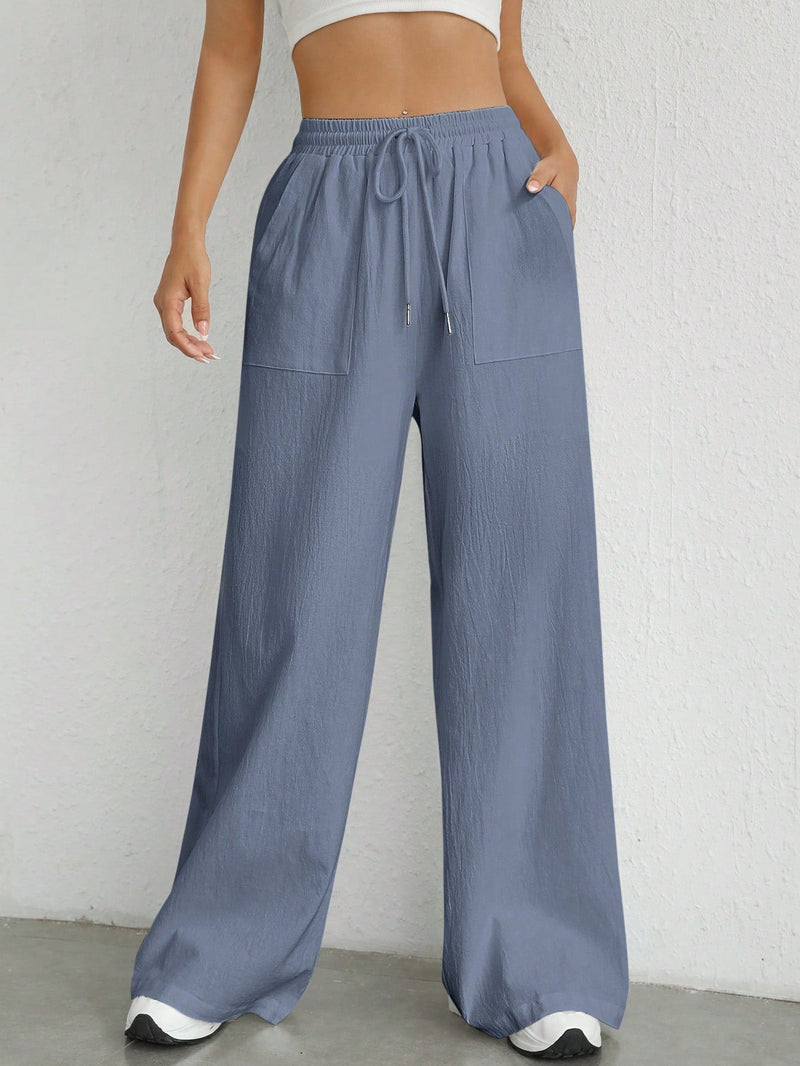 Pantalones sueltos de pierna ancha de color solido para mujer con dobladillo fluido, estilo casual