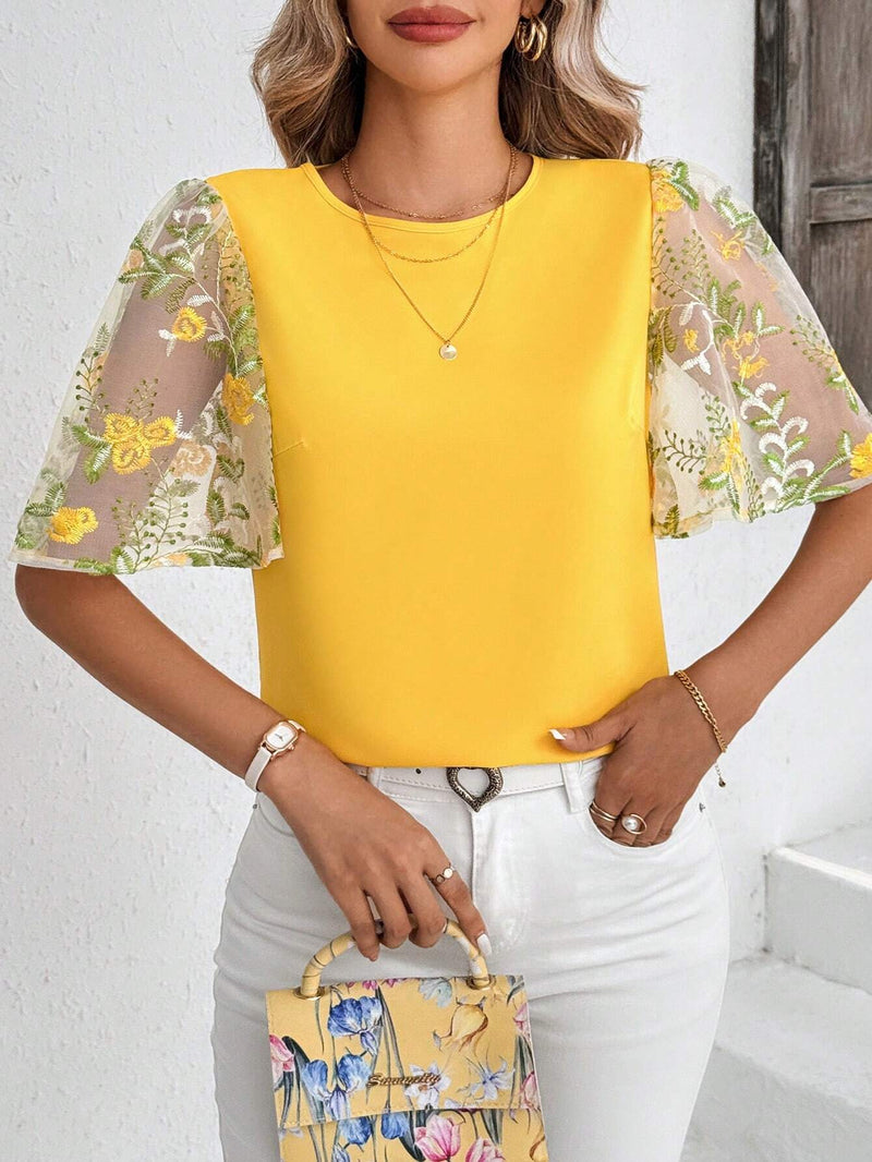 Blusa elegante amarilla de manga con volantes y bordados para damas