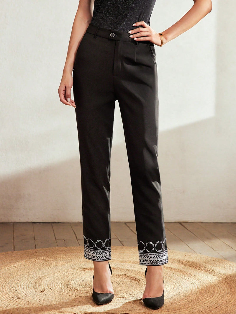 Motf classy pantalones con detalle de bordado y bolsillo oblicuo