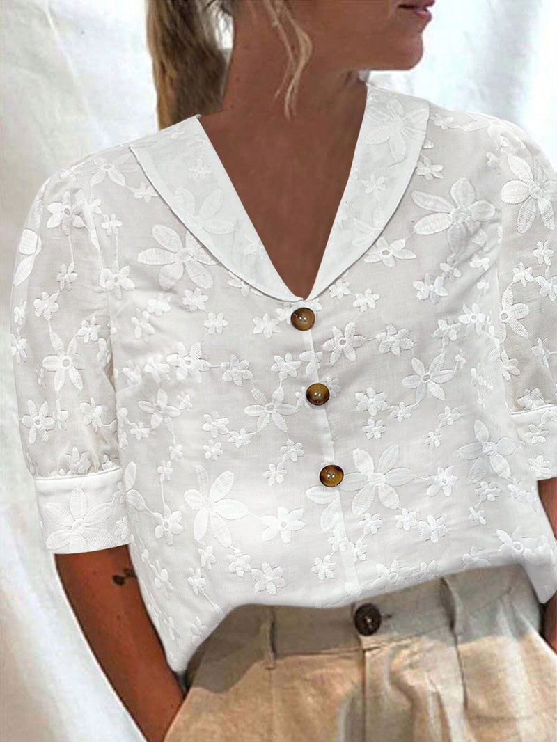 Camisa blanca translucida de manga princesa con cuello en V para mujer con bordados de flores