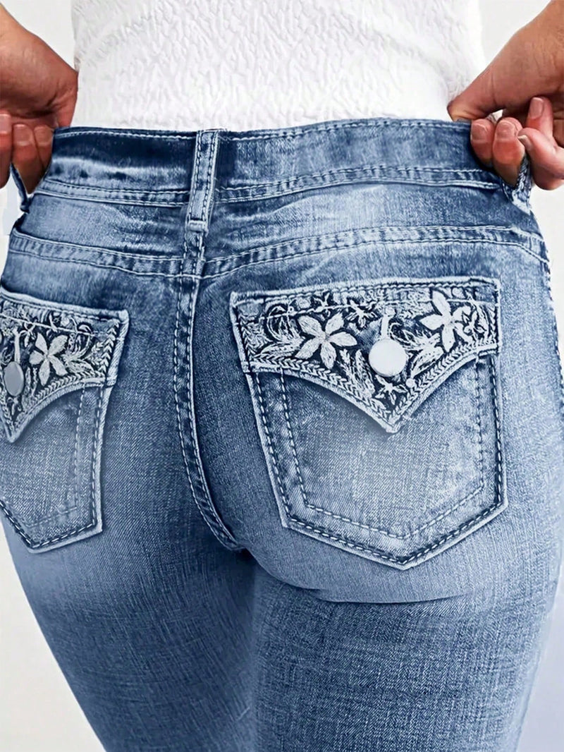 Jeans ajustados de moda para mujeres con bordado de flores en los bolsillos traseros