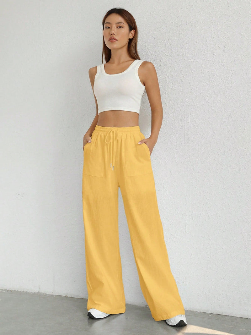 Pantalones sueltos de pierna ancha de color solido para mujer con dobladillo fluido, estilo casual