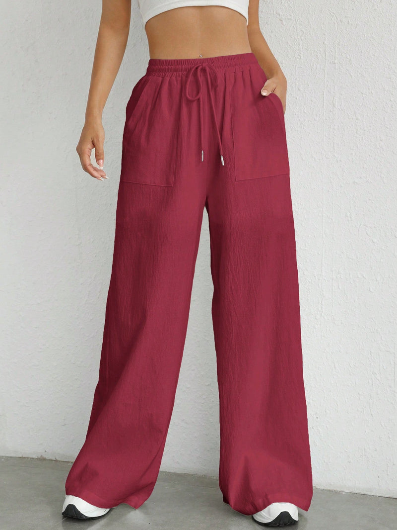 Pantalones sueltos de pierna ancha de color solido para mujer con dobladillo fluido, estilo casual