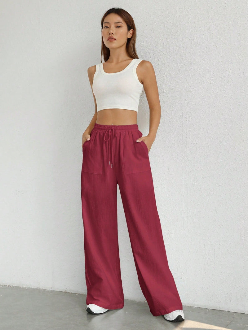 Pantalones sueltos de pierna ancha de color solido para mujer con dobladillo fluido, estilo casual