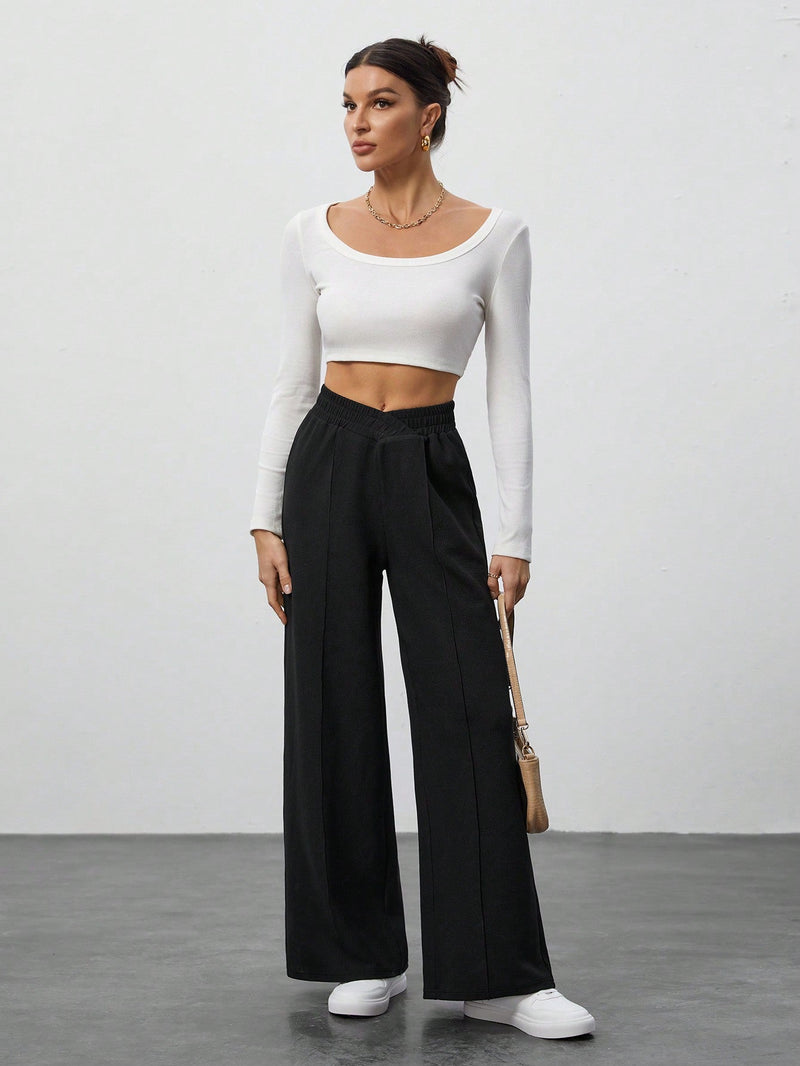 Tall pantalones anchos de pierna negros con envoltorio de cintura de unicolor para mujer