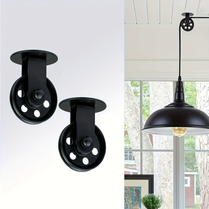 Un conjunto de 2 poleas negras de 2 pulgadas, 2 para luces de araña, diseñadas para poleas de pared vintage para luces de crecimiento de plantas en un gazebo industrial rústico.