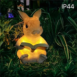 Estatuilla de Conejo con Luz LED Solar para Jardín - Decoración Exterior en Resina con Luz Cálida Amarilla, Ideal para Patios, Césped y Fiestas